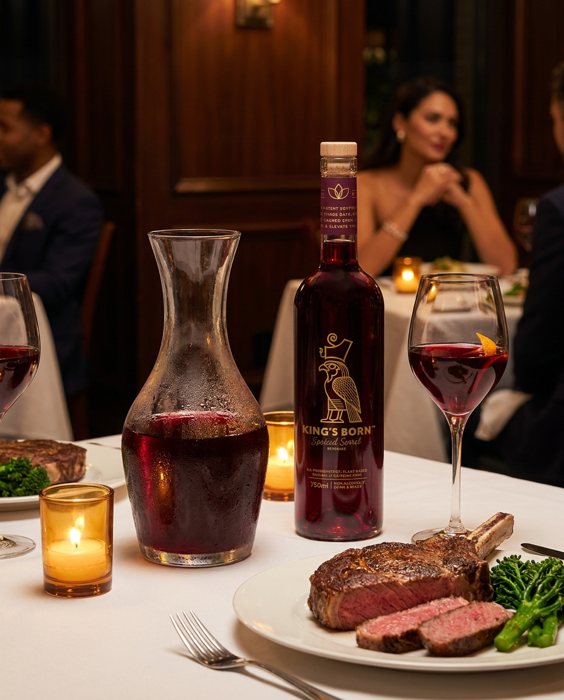 A bottle and carafe of King's Born sorrel on a steakhouse table
